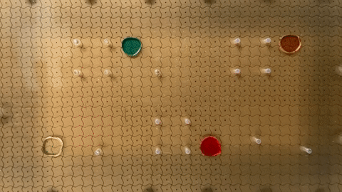 Electromechanical forces move droplets across an electrode board