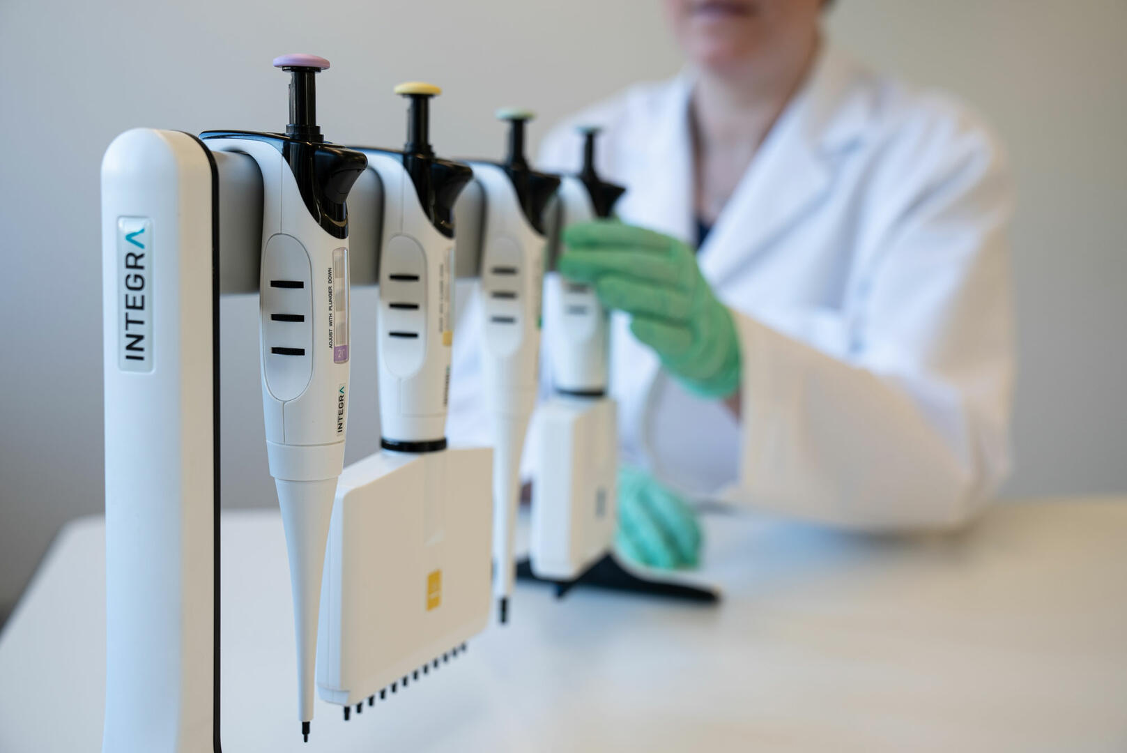 Scientist choosing a multichannel micropipette