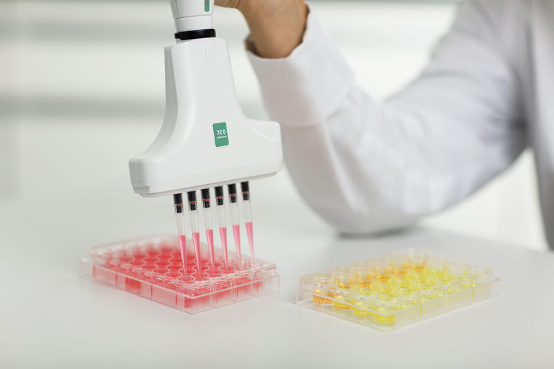 VOYAGER electronic multichannel pipette pipetting into a 48-well plate.