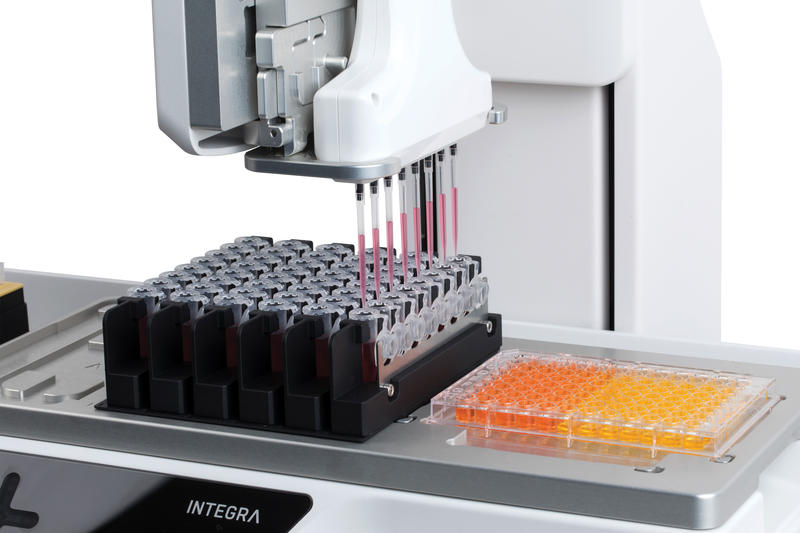 ASSIST PLUS pipetting robot using the VOYAGER adjustable tip spacing pipette to aspirate liquid from Eppendorf tubes.
