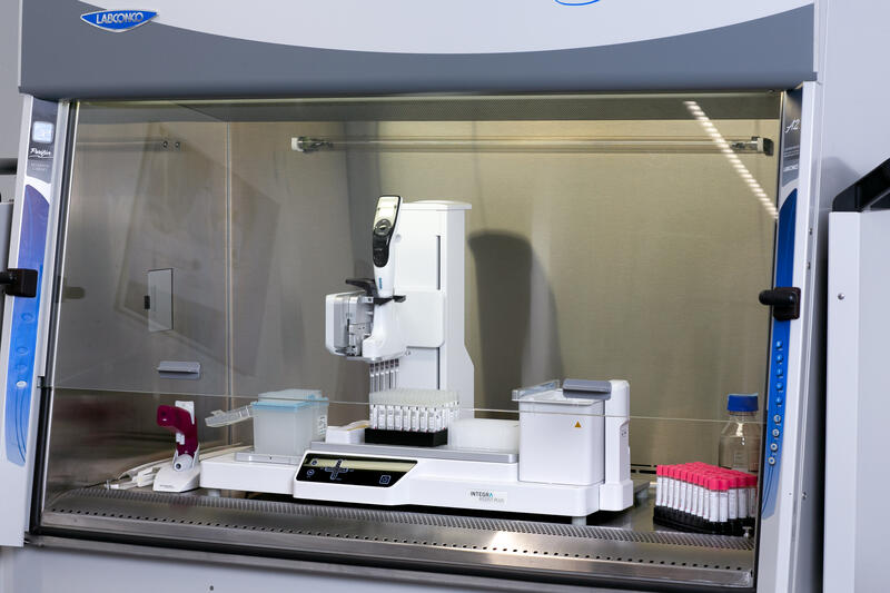 The ASSIST PLUS pipetting robot in a biosafety cabinet