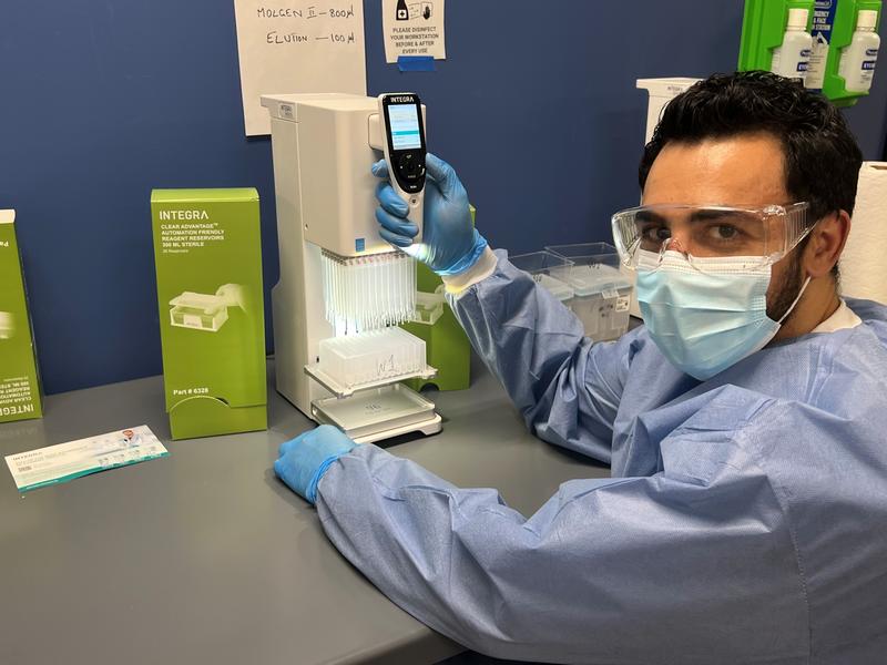 Fady Ettnas, Lab Manager at Matrix Diagnostics, using a MINI 96 pipette to perform PCR tests