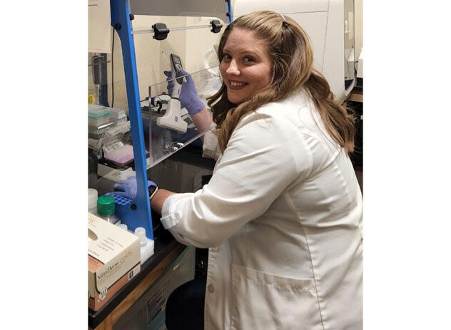Maria Esquivel is working with an INTEGRA VOYAGER pipette doing DNA extraction for pharmacogenomics testing at the El Paso Pain Center.