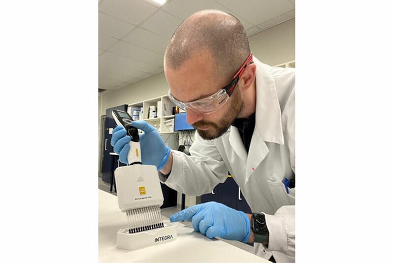 Ross Hamilton, Research Scientist at Pharmaxis, pipetting with a VIAFLO pipette