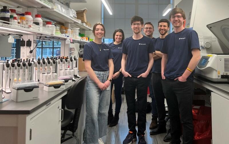 Nanopath team in their lab with EVOLVE manual pipettes on the bench.