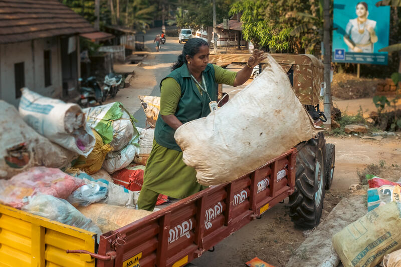 CleanHub employee unloading plastic waste