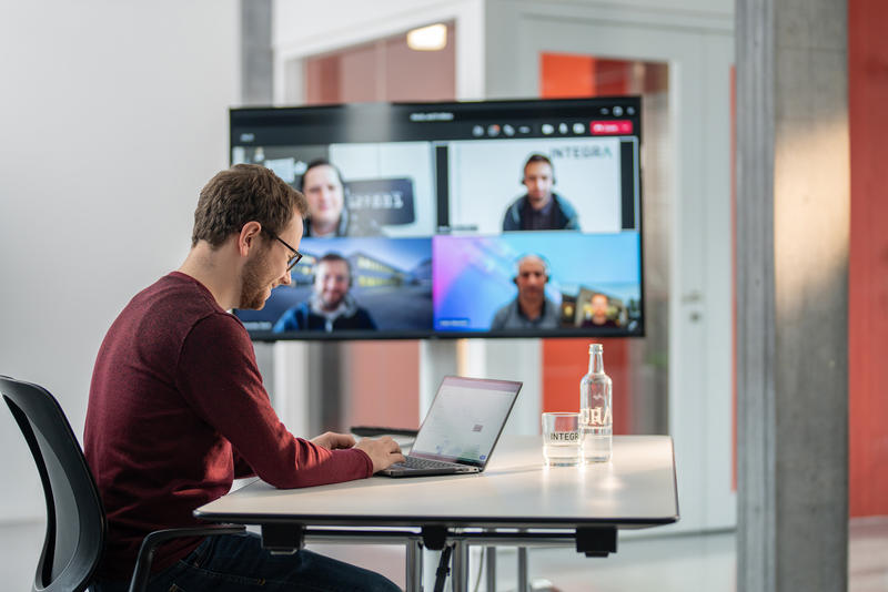 An INTEGRA Biosciences employee on a call with a multinational team.