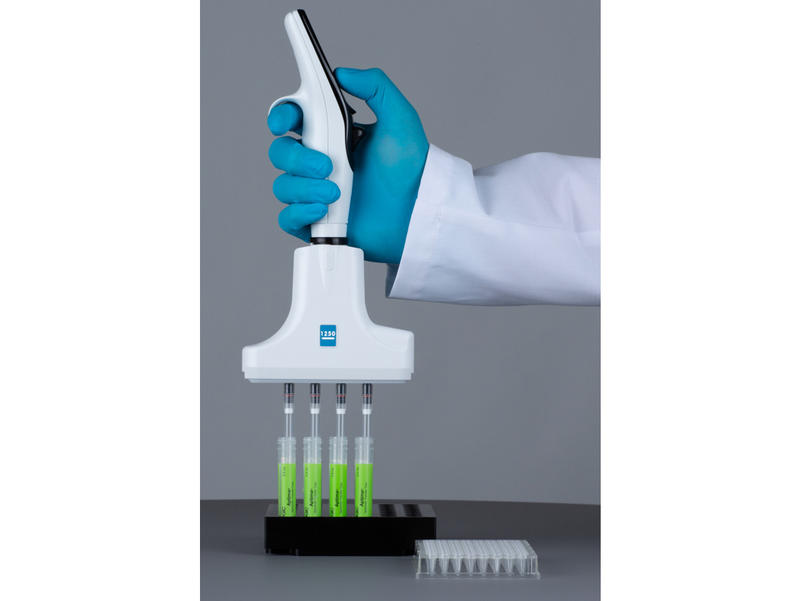 Scientist using a 4 channel VOYAGER pipette to transfer patient samples from swab tubes to a plate