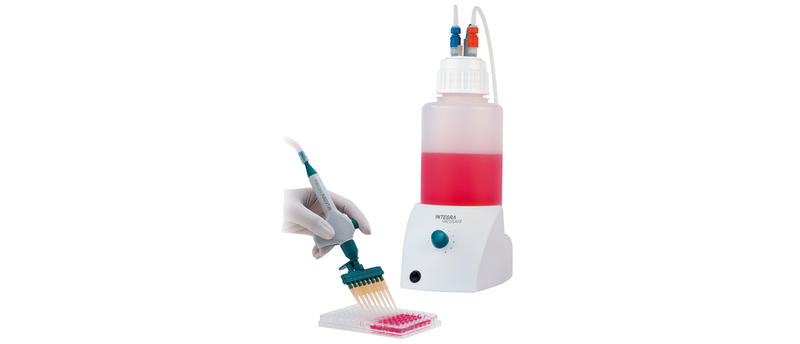 Liquid waste collection: Scientist aspirating liquid waste using the aspiration systems VACUBOY and VACUSAFE